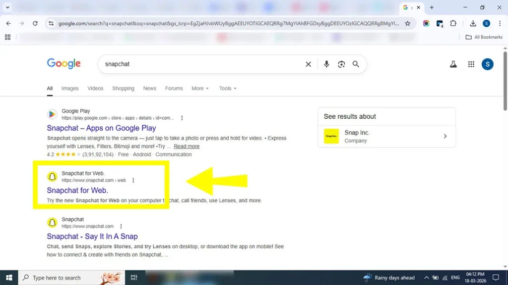 Selecting the official Snapchat login tab on a web browser.