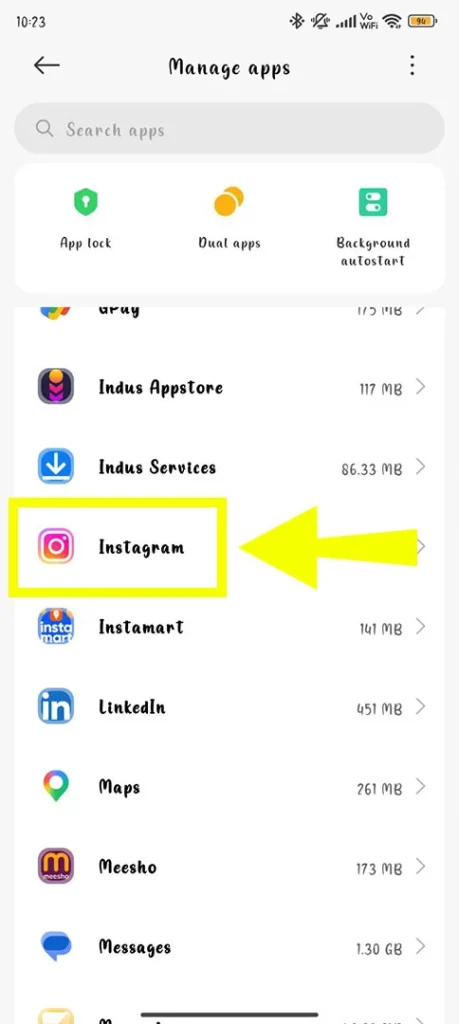 Scrolling through the Manage Apps list and tapping on the Instagram app icon to access storage settings.